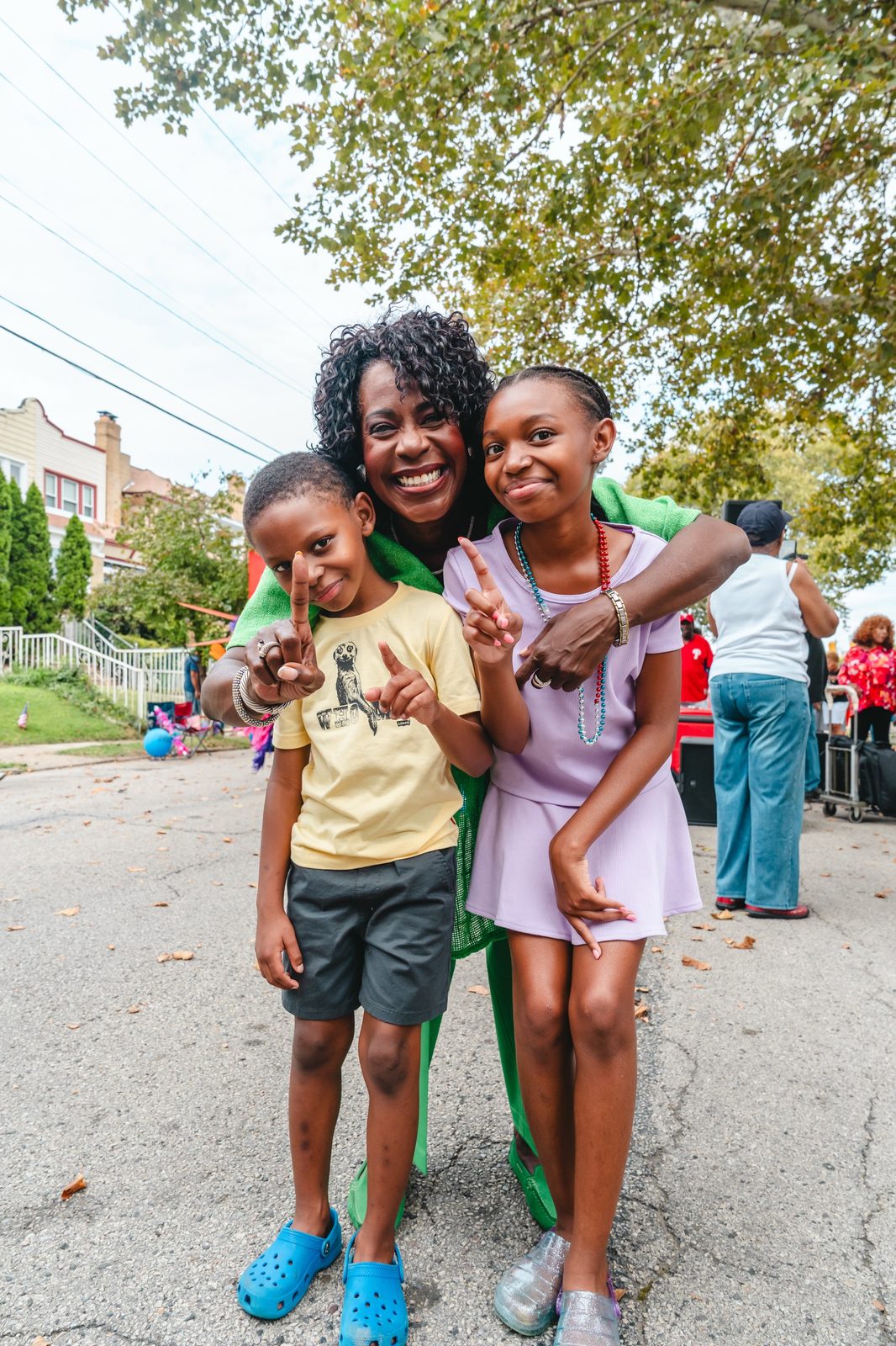Mayor Cherelle L. Parker with two young residents at the Block Party Bonanza